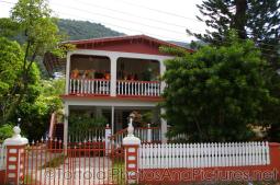 Red and white house at Cane Garden Bay in Tortola.jpg