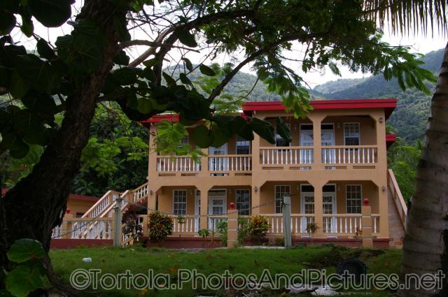 Two story house next to the ocean at Cane Garden Bay in Tortola.jpg
