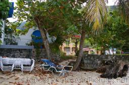 Trees and folded chairs at Cane Garden Bay beach in Tortola.jpg