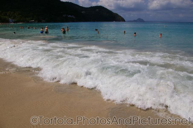 Wave hits the beach at Cane Garden Bay in Tortola (2).jpg
