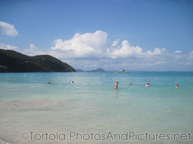 Vacationers wade in the waters of Cane Garden Bay in Tortola.jpg
