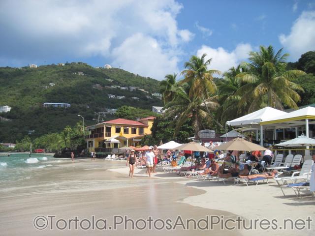White sand beach and lounge chairs at beach of Cane Garden Bay in Tortola.jpg
