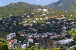 Colorful buildings and houses on hills next to Cane Garden Bay in Tortola.jpg
