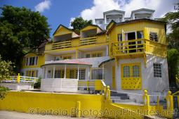 Small yellow and white hotel at Cane Garden Bay in Tortola.jpg