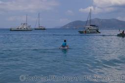 Kid on shoulders of an adult wading in the waters of Cane Garden Bay in Tortola.jpg
